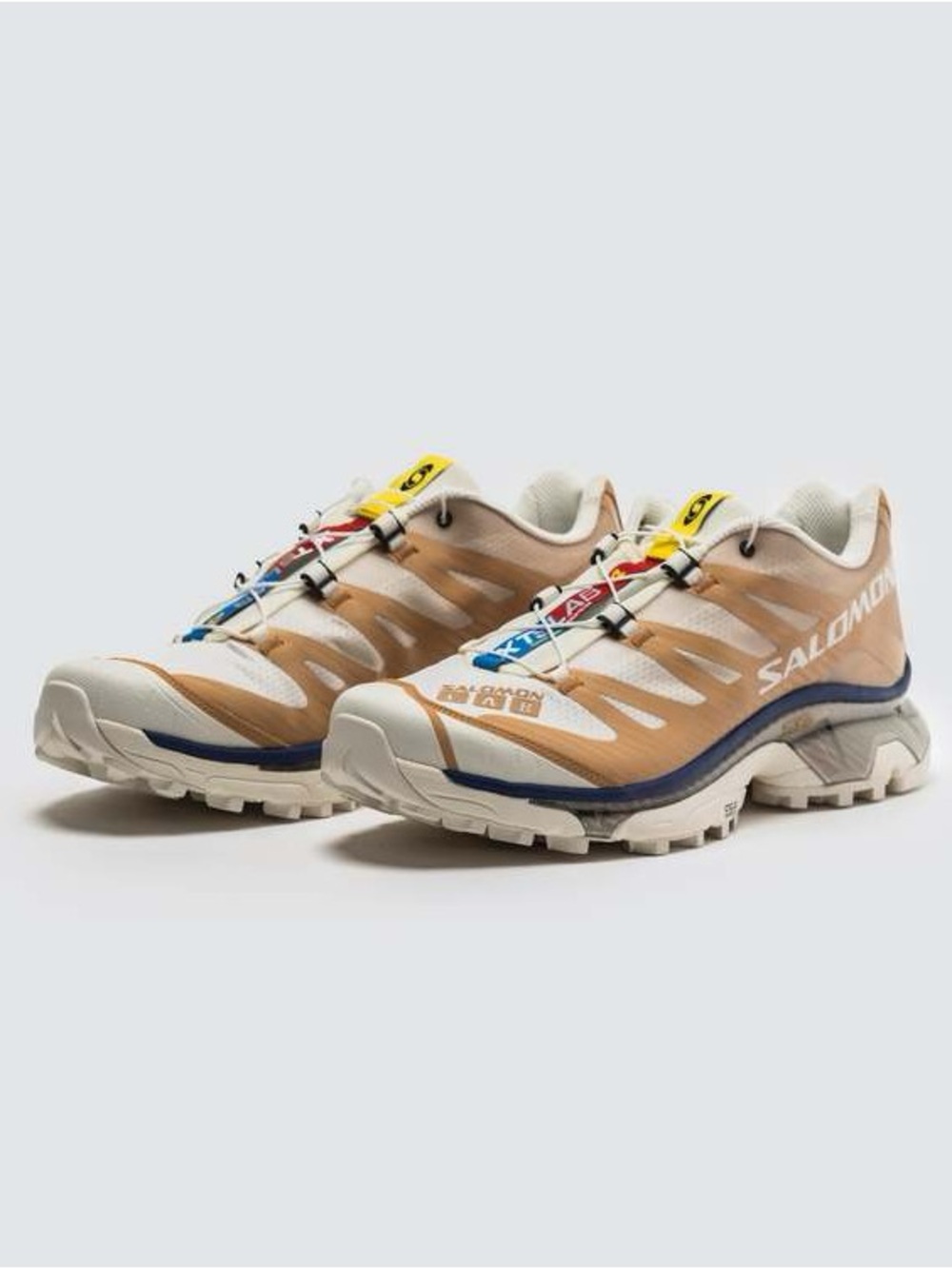Salomon Trail Sneakers in Beige with Blue and White Accents